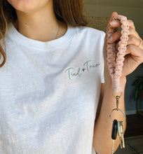 Load image into Gallery viewer, hand holding macrame wristlet keychains for scale