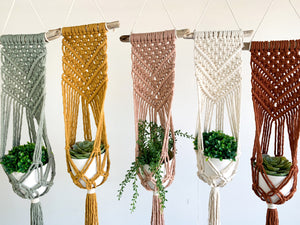 handmade driftwood plant hangers in sage, mustard, antique peach, natural and rust
