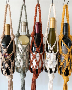 handmade macrame wine totes in dusty blush, sage, rust, natural and mustard